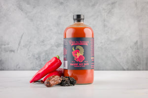 32oz bottle of Smokin' Hot Date. DTF's best selling sauce. chipotle, guajillo and dates!